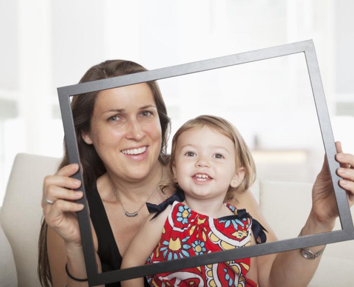 A child and adult with a frame