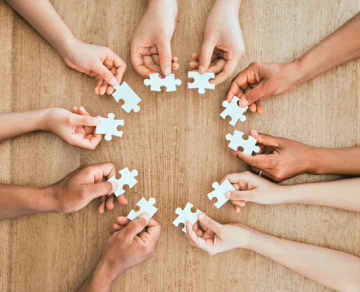 hands with puzzle pieces