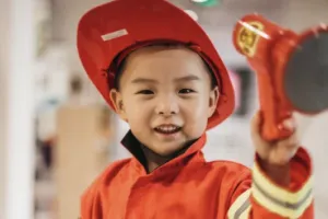 Boy dressed as firefighter