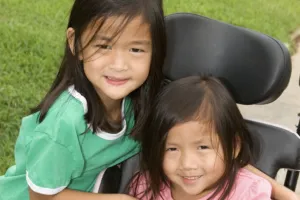 Siblings - One girl in wheelchair