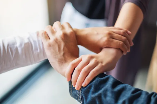 3 hands interlocked