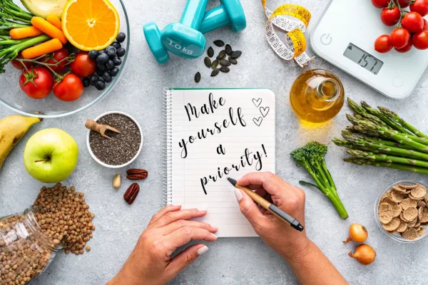 Picture of wellness journal and healthy foods
