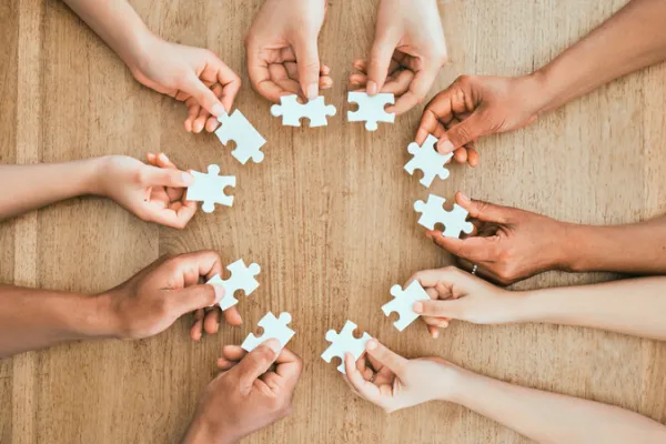 hands with puzzle pieces